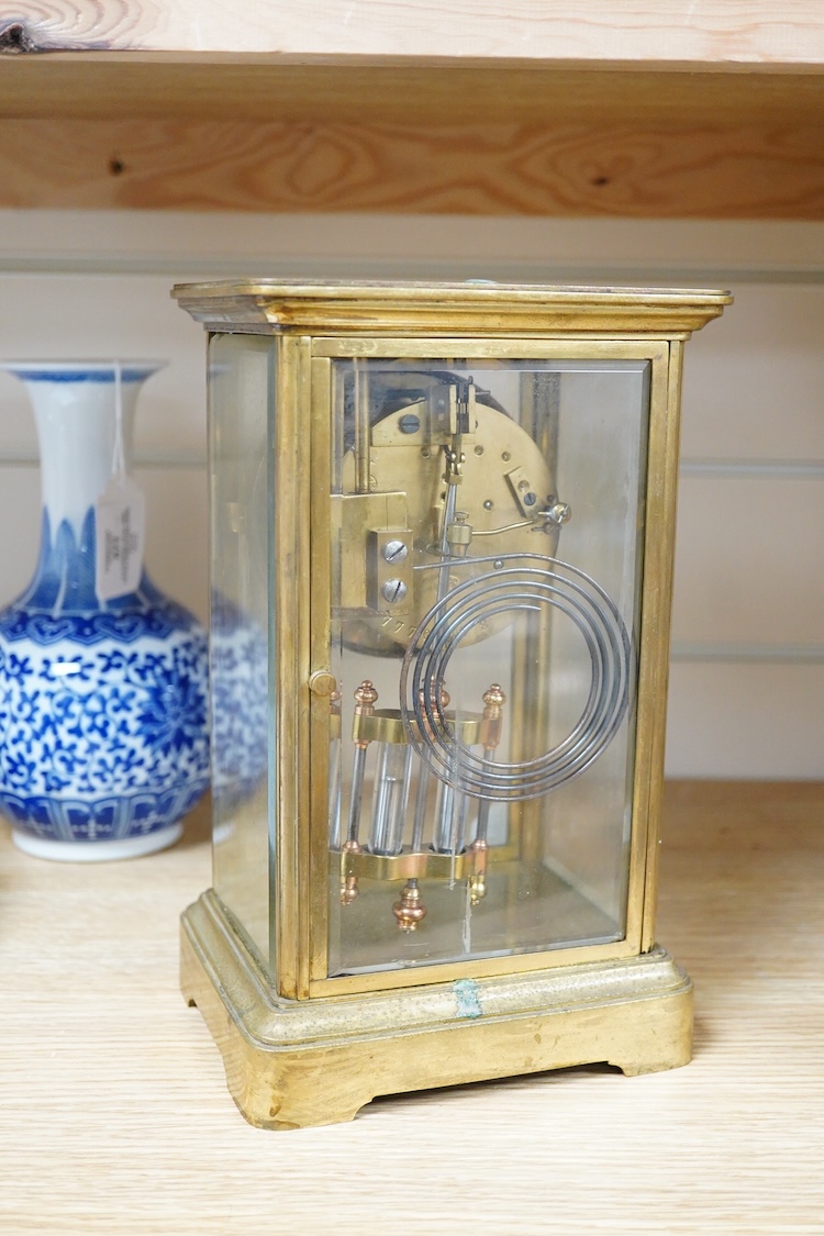 A late 19th century French brass four glass mantel clock, 25.5cm high